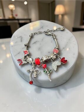 Silver Charm Bracelet with Red Floral and Crystal Accents